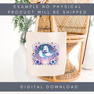 May include: A cream tote bag with a colourful illustration of two ghost characters reading a book, surrounded by flowers. The text "BOO-TIFULLY BOOKISH" is above the ghosts. The bag is near a wicker chair and a white vase.
