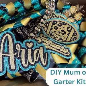 May include: A DIY Mum or Garter Kit featuring teal, gold, and black ribbons. The kit includes a glittery "Aria" name tag, a football-shaped charm with a leopard print design, and "Jaguars" text. Decorative elements include rhinestones and floral accents.