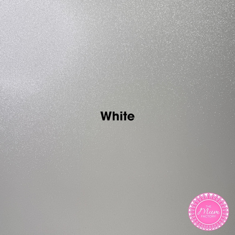 May include: A solid white surface with a fine, shimmering, glitter-like texture. The word "White" is printed in bold black sans-serif font in the center. A circular pink logo with the text "THE MUM FACTORY" is located in the bottom right corner.