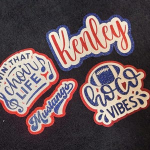 four stickers with various text and designs, including a football, a quote, and other decorative elements.