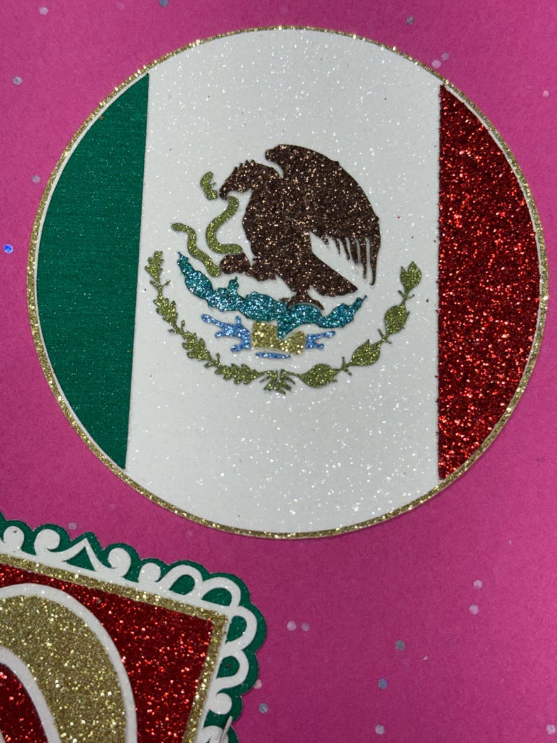 a circular design with a red, white, and green border, and a decorative border around the border. The border is adorned with glitter and has a pattern of leaves and flowers.