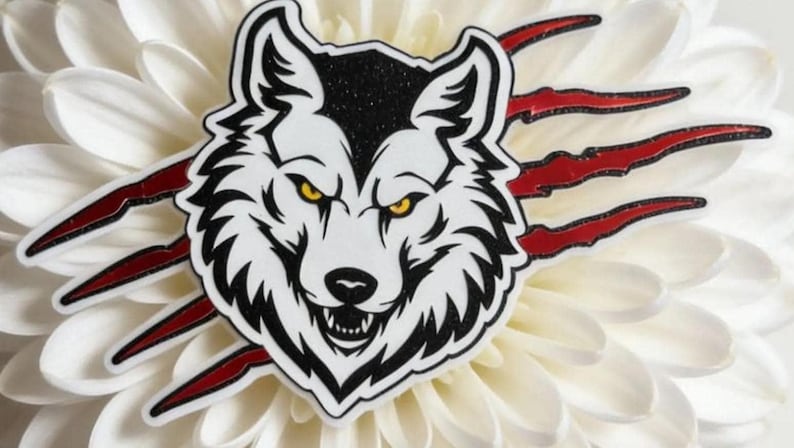 A white flower with a stylized black and white wolf head on it, surrounded by red spikes.