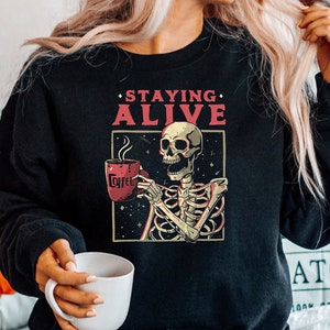 Staying Alive Coffee Sweatshirt, Halloween Sweater for Women Stay Oversized Crewneck, Trendy Sweatshirt, Funny Skeleton Sweatshirt