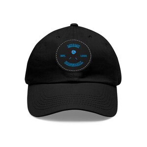 May include: Black baseball cap with a white patch featuring a blue and white baseball logo with the text "MIAMI BASEBALL EST. 1929".