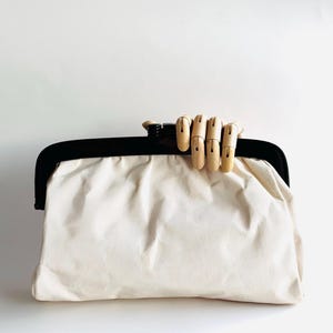 vintage Large kisslock frame clutch made in Italy in Ecru grosgrain fabric with black acrylic and metal frame