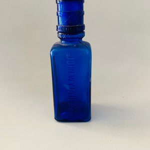 Antique cobalt blue glass bottle John Wyeth & Bro with cap