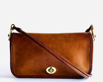 Vintage rare Coach mini clutch early Dinky shoulder bag purse 1970s wonderful patinaed British Tan or Tabac leather by Bonnie Cashin #9375