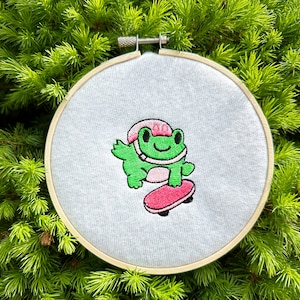 Funny skater frog machine embroidery design