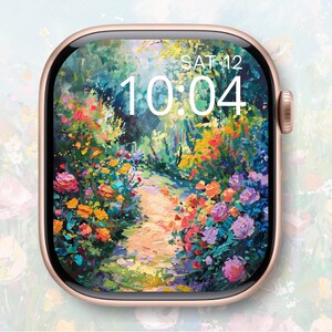 Puede incluir: Un reloj inteligente de oro rosa muestra una colorida pintura impresionista de un camino de jardín floral. La hora es 10:04 el sábado 12. El reloj tiene una esfera cuadrada redondeada y un botón lateral.