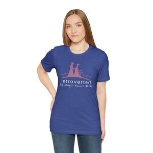 May include: A royal blue t-shirt with a pink graphic of two people walking on a bridge. The text "Introverted but willing to discuss C-Drama" is printed below the graphic.