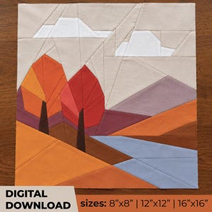 May include: A fabric quilt block pattern featuring a geometric landscape with two trees in orange and red, a blue river, purple mountains, and white clouds against a beige sky. Text reads: DIGITAL DOWNLOAD sizes: 8"x8" | 12"x12" | 16"x16".