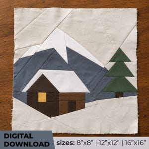 May include: A fabric quilt block pattern featuring a mountain landscape with a cabin and a pine tree. The design includes white, gray, dark brown, and green fabric pieces. Text at the bottom reads: DIGITAL DOWNLOAD sizes: 8"x8" | 12"x12" | 16"x16".