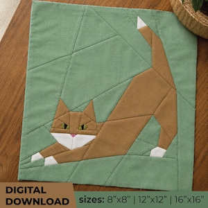 May include: A fabric quilt block pattern featuring a brown cat with white paws and a white tail tip, set against a sage green background with geometric piecing lines. The text reads DIGITAL DOWNLOAD and lists sizes 8 inches by 8 inches, 12 inches by 12 inches, and 16 inches by 16 inches.
