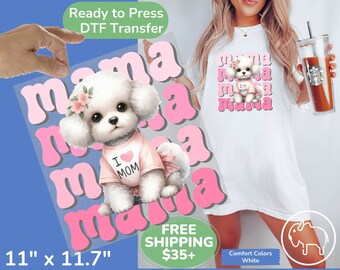 May include: A DTF transfer featuring a cute white poodle wearing a pink "I MOM" shirt and flower crown, with the word "mama" in pink retro font. The transfer measures 11" x 11.7".