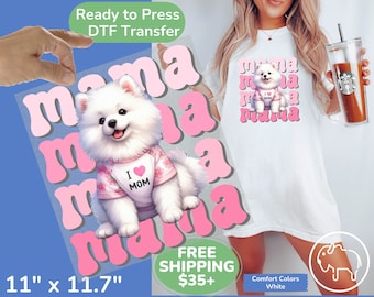 May include: A white heat transfer design featuring a white dog wearing a pink shirt with the text "I love Mom" on it. The dog is surrounded by the word "mama" repeated in a pink and white gradient. The design is 11 inches by 11.7 inches.