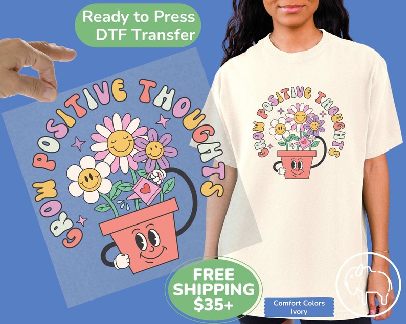 May include: A light pink and blue iron-on transfer design featuring a flower pot with a smiling face and the text "Grow Positive Thoughts".