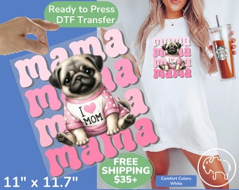 May include: A pink and white iron-on transfer design featuring a pug wearing a pink shirt with the words "I love Mom" on it. The design also includes the word "mama" repeated multiple times in a stylized font.