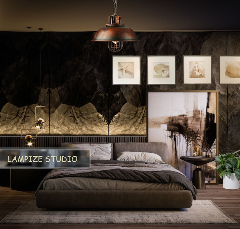 May include: A dark brown leather bed with a brown blanket and white pillows in a bedroom with a dark brown wall and a large painting above the bed. A rustic metal cage pendant light hangs from the ceiling. The text "LAMPIZE STUDIO" is visible in the lower left corner of the image.