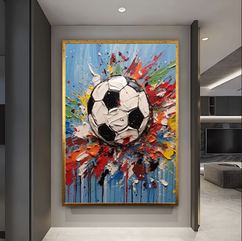 May include: A colourful abstract painting of a football with splashes of paint in shades of blue, green, yellow, red, and orange.