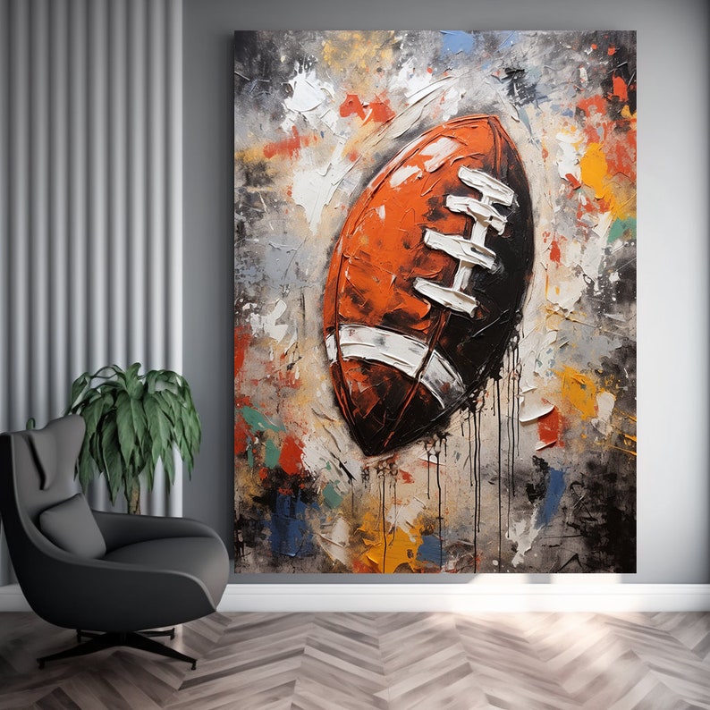 May include: Abstract painting of a football on a colourful background. The football is brown and white with a textured surface. The background is a mix of colours, including yellow, orange, blue, green, and grey.