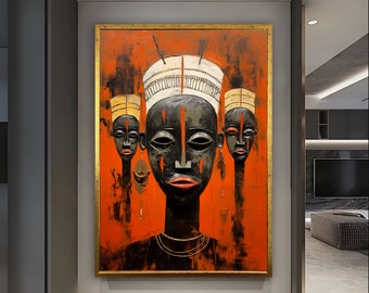 Può includere: Un dipinto di tre volti africani stilizzati con tratti neri e bianchi su uno sfondo rosso. Il volto centrale è il più grande e indossa un copricapo bianco. Il dipinto è incorniciato in oro.