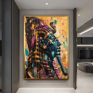 May include: A colorful abstract painting of a pharaoh's head with a gold background. The pharaoh is wearing a blue and gold headdress with a large, ornate beard.