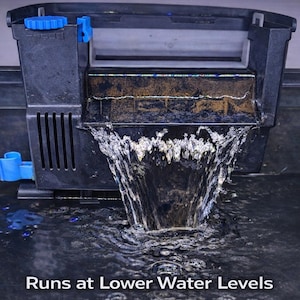 May include: Black aquarium filter with blue accents, water cascading from the filter. The text "Runs at Lower Water Levels" is displayed at the bottom of the image. The filter is designed for aquariums.