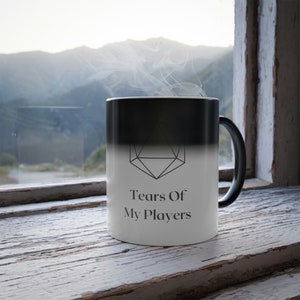 May include: A black and white color-changing mug with a geometric design and the text "Tears Of My Players".