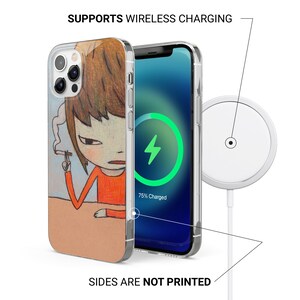 May include: A clear phone case with a colorful illustration of a person with brown hair and a red shirt. The phone case is compatible with wireless charging and shows a charging indicator on the screen that says "75% Charged".