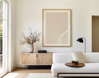 May include: A white sofa with a wooden tray table and a beige framed print of abstract lines on a beige background. The sofa is in a living room with a wooden cabinet and a vase of dried flowers.