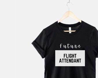 May include: Black t-shirt with white text that reads "future flight attendant".