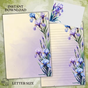Pode incluir: Papelaria imprimível com um design de aquarela de íris roxas e azuis sobre um fundo roxo claro. O papel é do tamanho de uma carta e tem espaço de escrita com linhas.