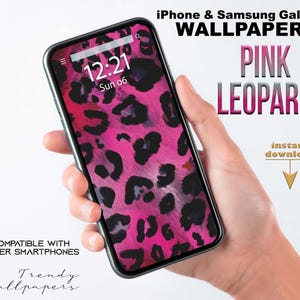May include: A smartphone displaying a pink leopard print wallpaper. The phone screen shows the time as 12:21, Sunday, June 6. Text on the image reads "iPhone & Samsung Galaxy Wallpaper" and "Pink Leopard". Additional text says "Compatible with other smartphones" and "instant download".