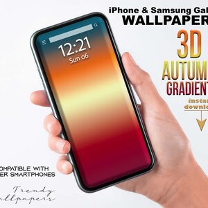 Puede incluir: Un smartphone que muestra un fondo de pantalla degradado otoñal en 3D en tonos rojos, naranjas y amarillos. La pantalla muestra la hora 12:21. El texto de la imagen dice "iPhone & Samsung Galaxy Wallpaper" y "Compatible con otros smartphones."