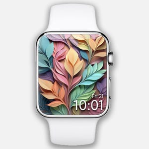 May include: A white Apple Watch with a colorful floral design watch face. The watch face displays the time as 10:01 and the date as Fri 21.