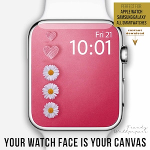 Puede incluir: Un smartwatch blanco con una esfera rosa que muestra la hora 10:01 y la fecha viernes 21. La esfera presenta margaritas blancas y gráficos de corazón. El texto "YOUR WATCH FACE IS YOUR CANVAS" está en la parte inferior.