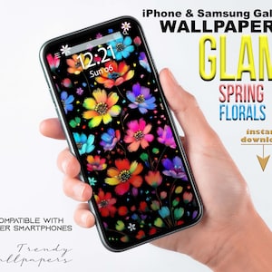 May include: A smartphone displaying a colorful floral wallpaper with a black background. The phone's screen shows the time as 12:21 and the date as Sun 06. The text "iPhone & Samsung Galaxy WALLPAPER GLAM SPRING FLORALS instant download" is displayed above the phone.