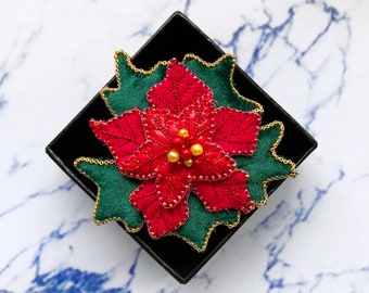 Red poinsettia brooch