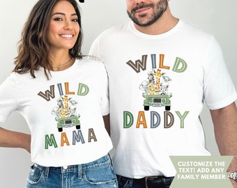 May include: White t-shirts with a green jeep and animals on it. The text on the shirts says "Wild Mama" and "Wild Daddy".