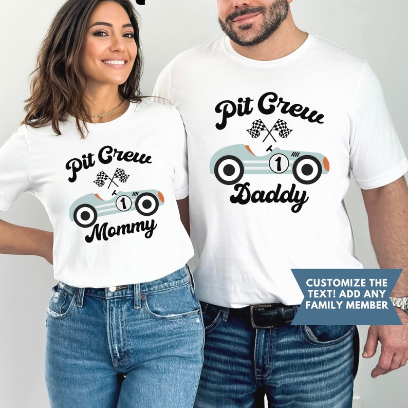 May include: Two white t-shirts with a blue vintage race car graphic and the text "Pit Crew" with "Mommy" and "Daddy" below the car.  The text is in a black cursive font.