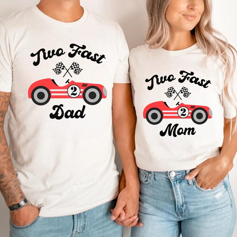 May include: Two white t-shirts with a red race car graphic and the text "Two Fast Dad" and "Two Fast Mom".