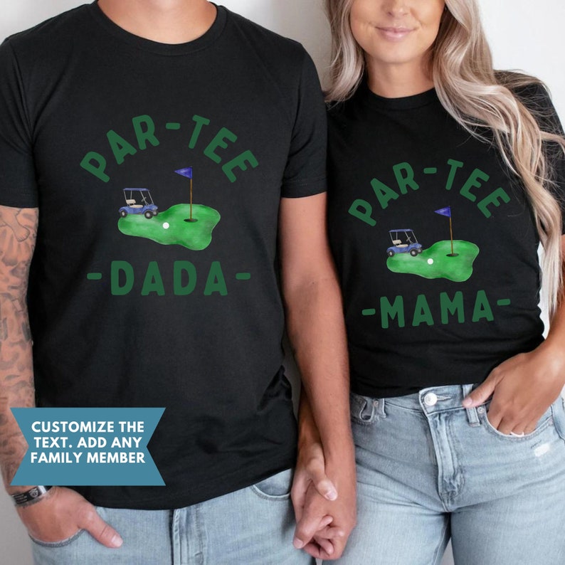 May include: Black t-shirts with a green golf-themed design. The shirts feature the text "PAR-TEE" above a golf course graphic with a golf cart, ball, and flag. One shirt says "DADA" and the other says "MAMA".