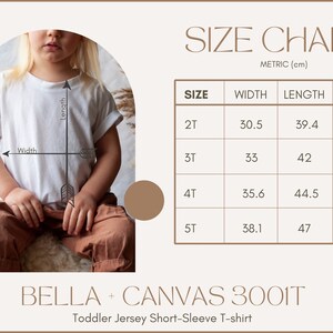 May include: Size chart for a toddler jersey short-sleeve t-shirt. The chart shows the width, length, and EU size in centimeters for sizes 2T, 3T, 4T, and 5T.