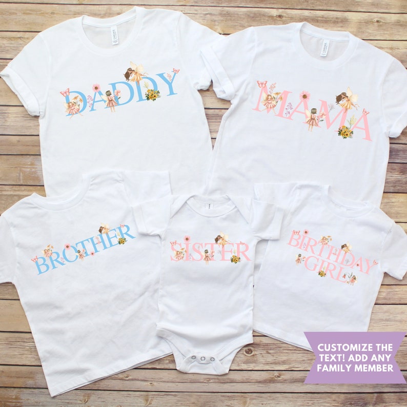 May include: Five white t-shirts and one white baby bodysuit featuring fairy and floral graphics. The shirts display the text DADDY, MAMA, BROTHER, SISTER, and BIRTHDAY GIRL in blue or pink lettering. A purple banner reads CUSTOMIZE THE TEXT! ADD ANY FAMILY MEMBER.