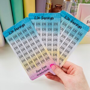 May include: Four colorful cards with a watercolor background and a grid of squares. Each square has the text "&pound;20" written inside. The cards are labeled "&pound;20 Savings" and the bottom card has the text "Save &pound;800 @budgetswithbeth".