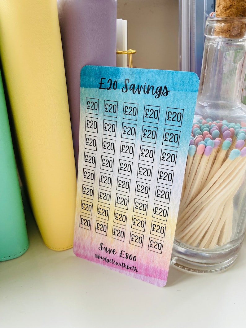 May include: A colorful card with a watercolor background and a grid of squares. Each square contains the text "&pound;20". The card has the text "&pound;20 Savings" at the top and "Save &pound;800 @budgetswithbeth" at the bottom.