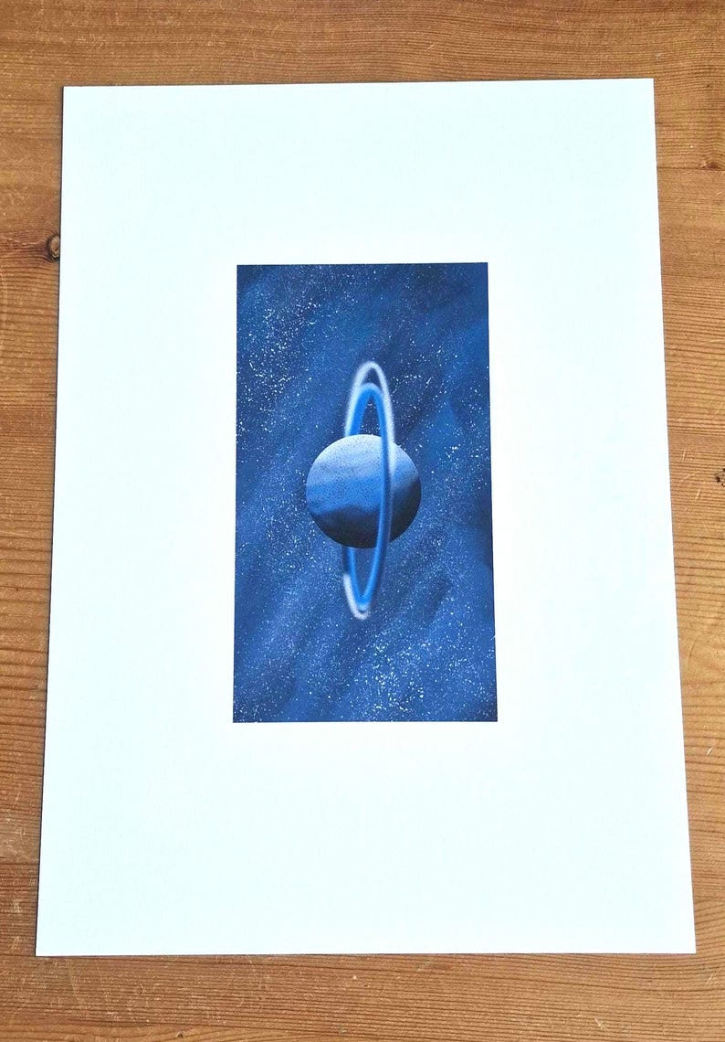 May include: A blue planet with a ring system against a dark blue starry background.