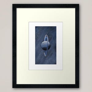 May include: A blue planet with a ring around it, set against a dark blue starry background.