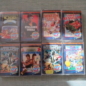 May include: Eight vintage video game cartridges with colorful labels and titles including "Wonder Boy", "Stallone Cobra", "Match Day II", "Target Renegade", "Run the Gauntlet", "Dragon Ninja", "Run the Gauntlet", and "The New Zealand Story".