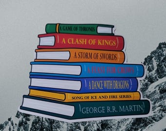 Bücherstapel mit George R. R. Martin Titel Laptop/Wasserflasche Aufkleber
